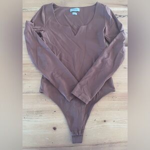 Babaton bodysuit size small.